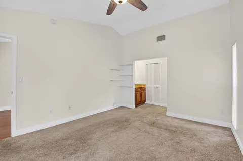 a view of storage and utility room with racks on the wall
