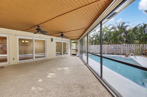 a view of a swimming pool with a lounge chairs