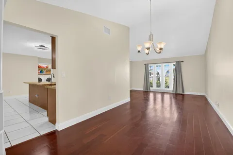 a kitchen with stainless steel appliances granite countertop a sink stove and microwave