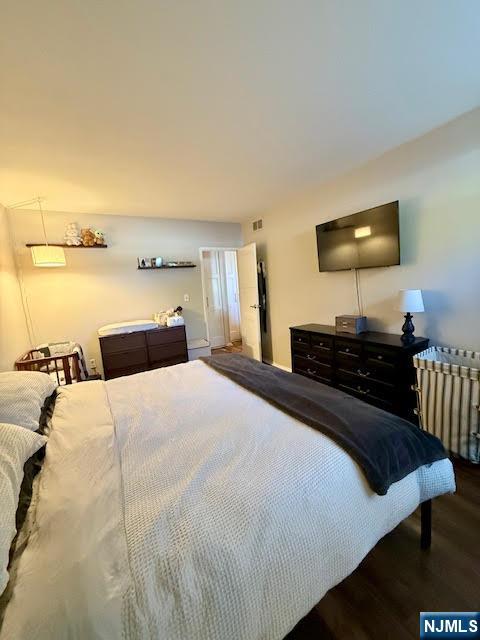 458 River, Unit C Nutley, NJ 07110 - Photo 11 of 15 a bedroom with bed and a night stand