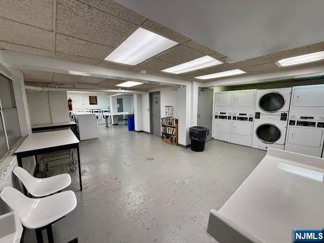 458 River, Unit C Nutley, NJ 07110 - Photo 14 of 15 a living room with furniture and a glass door shower