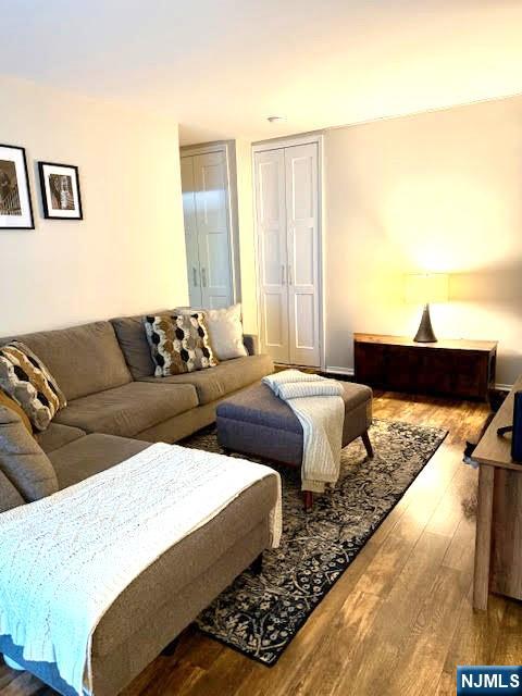 458 River, Unit C Nutley, NJ 07110 - Photo 2 of 15 a living room with couches and painting on the wall