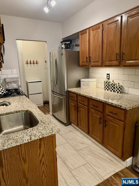 458 River, Unit C Nutley, NJ 07110 - Photo 4 of 15 a kitchen with stainless steel appliances granite countertop a sink stove and refrigerator