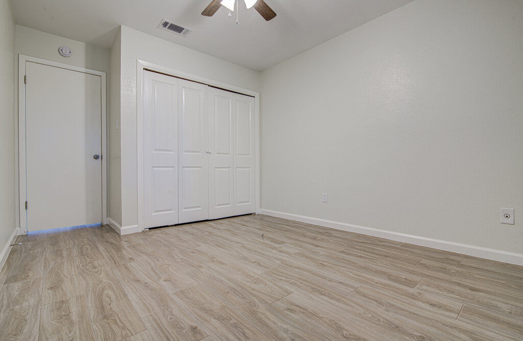 5301 Indio Circle, Unit A Austin, TX 78745 - Photo 12 of 25 A well-lit bedroom with fresh flooring and a spacious closet awaits.