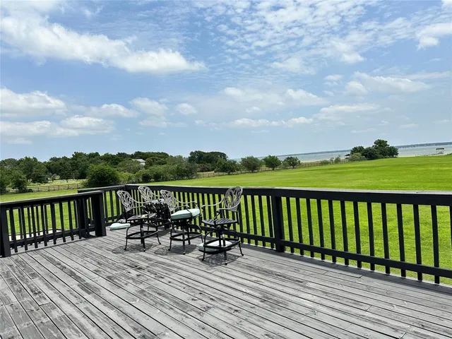 a view of balcony with deck and wooden floor