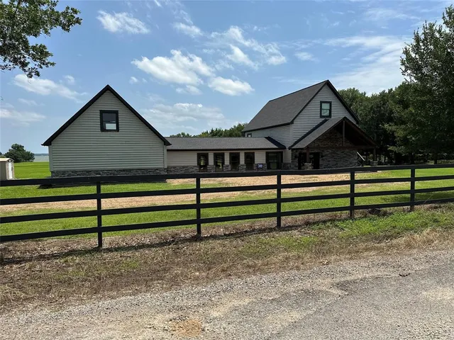 front view of a house with a garden