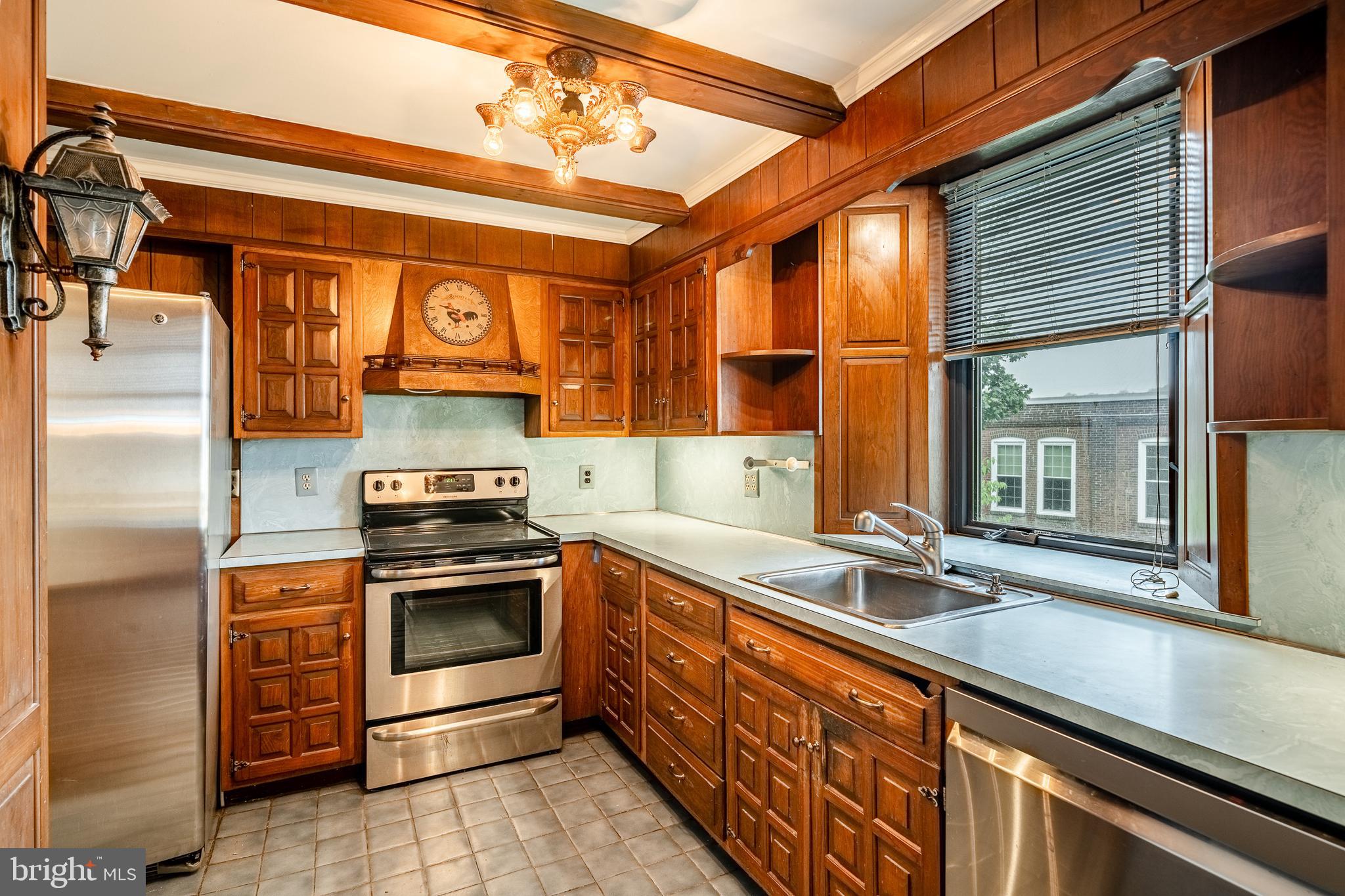 115 Bridge Street Spring City, PA 19475 - Photo 12 of 34 a kitchen with stainless steel appliances granite countertop a sink and a stove