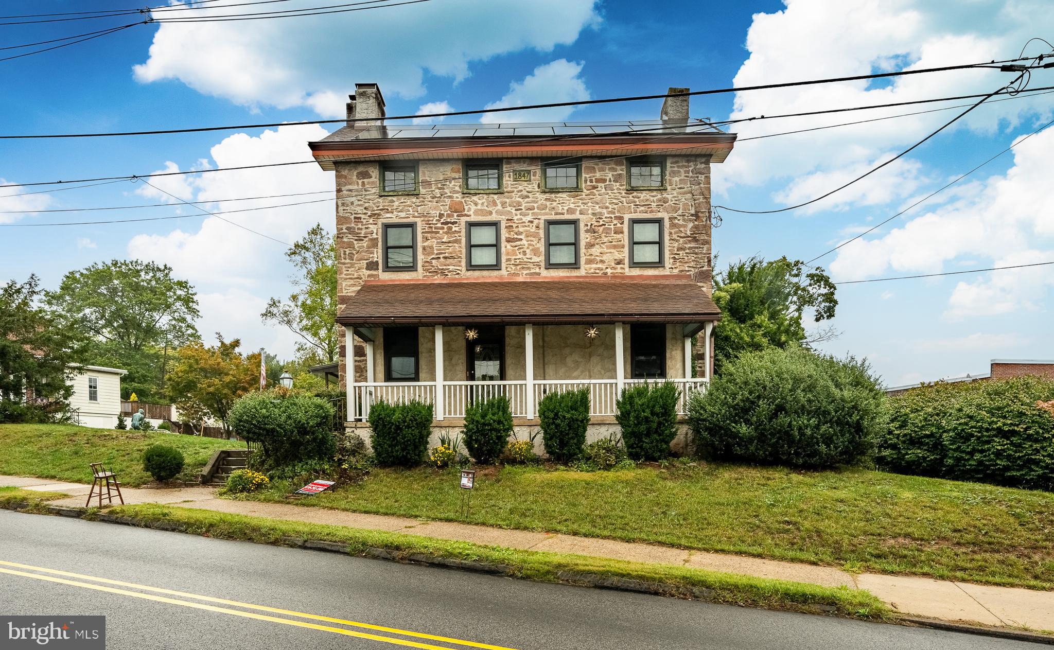 115 Bridge Street Spring City, PA 19475 - Photo 2 of 34 a front view of a house with a yard and potted plants