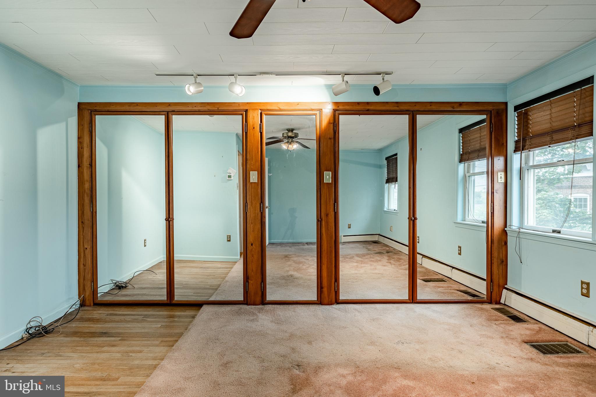 115 Bridge Street Spring City, PA 19475 - Photo 26 of 34 an empty room with sliding door and mirror