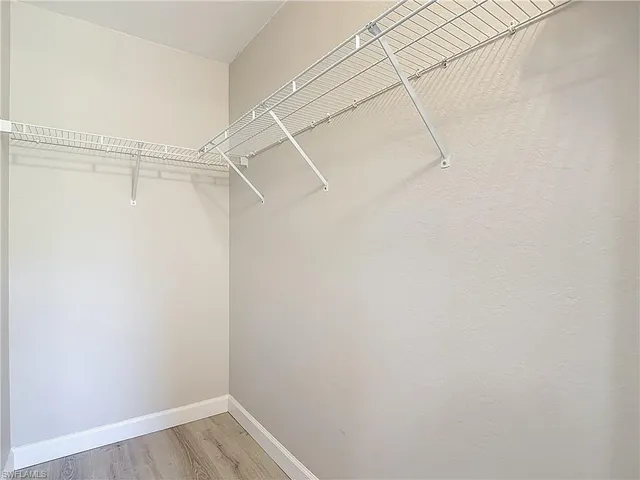 a view of a room with racks on the wall