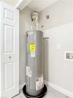 a view of a hallway with wooden cabinets