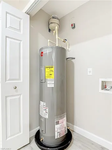 a view of a hallway with wooden cabinets