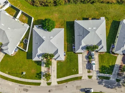 an aerial view of a house with a garden and swimming pool
