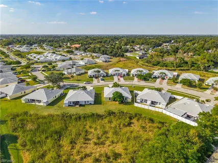 an aerial view of residential houses with outdoor space