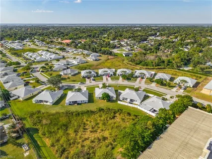 an aerial view of residential houses with outdoor space