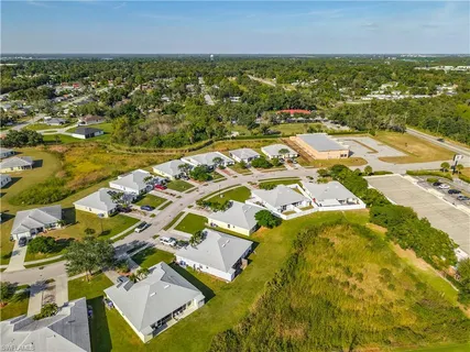 an aerial view of residential houses with outdoor space