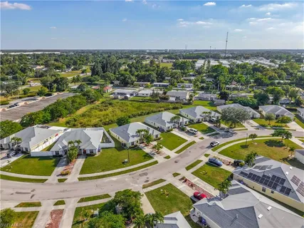 an aerial view of residential houses with outdoor space