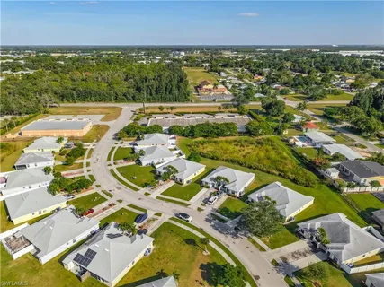 an aerial view of residential houses with outdoor space