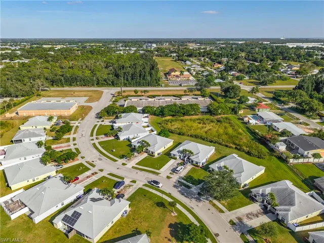 an aerial view of residential houses with outdoor space