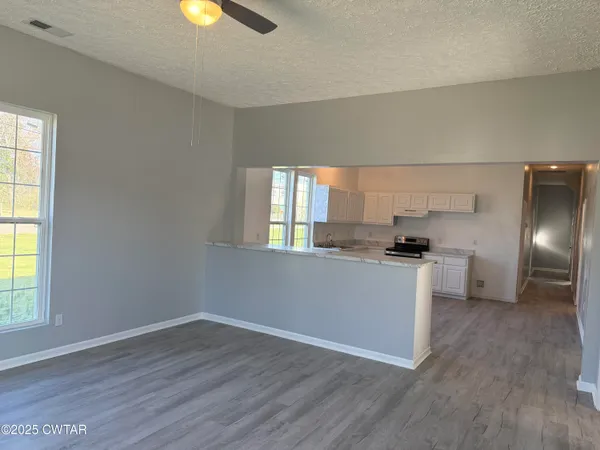 a kitchen with cabinets and stainless steel appliances
