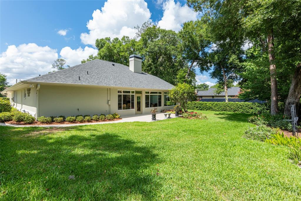 2215 Spring Hill Court Ocala, FL 34471 - Photo 53 of 62 a front view of a house with a garden and porch