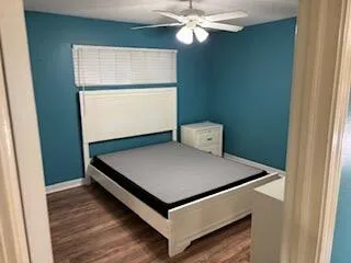 a room with a bed and a window