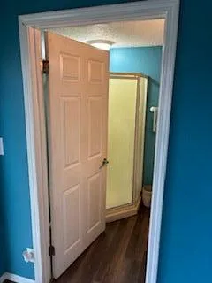 a view of front door with wooden floor