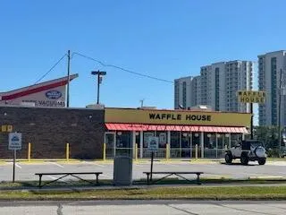 a front view of a building with street view