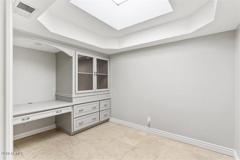 4438 East Camelback Road, Unit 143 Phoenix, AZ 85018 - Photo 18 of 30 a view of an empty room with cabinet