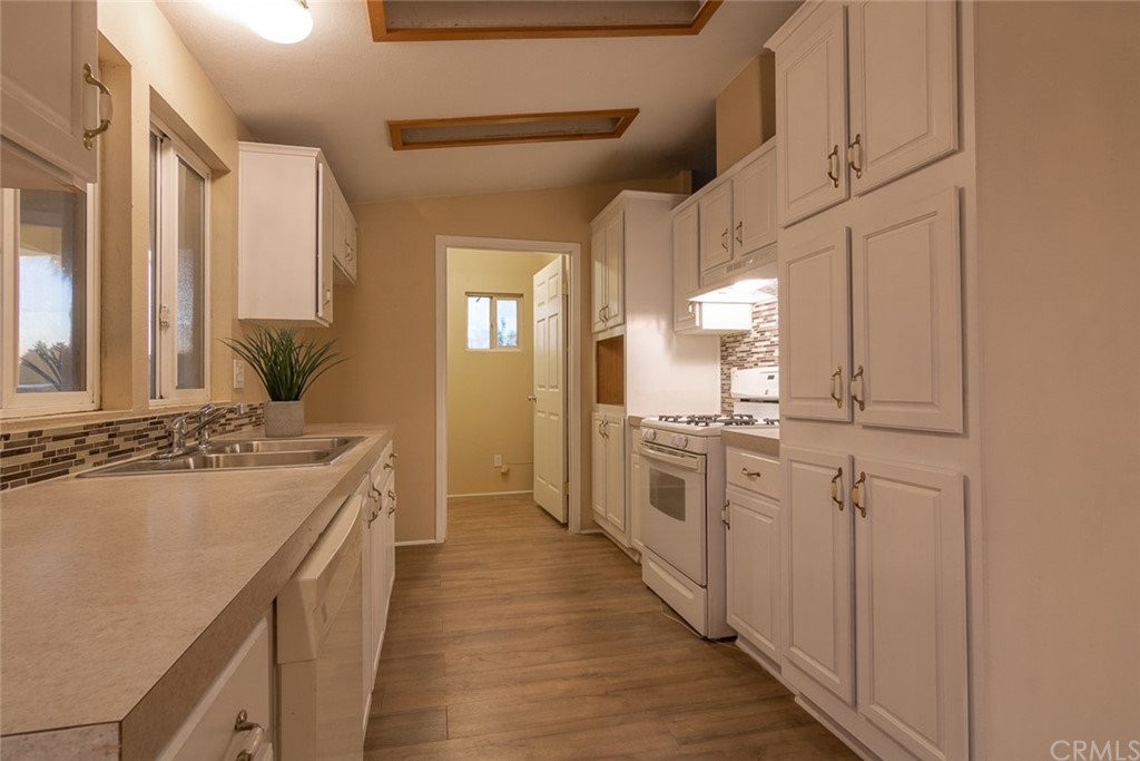 235 Navajo Road Perris, CA 92570 - Photo 1 of 1 a large bathroom with a granite countertop double vanity sink a mirror and a shower
