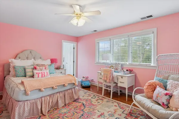 a bedroom with a bed and a table