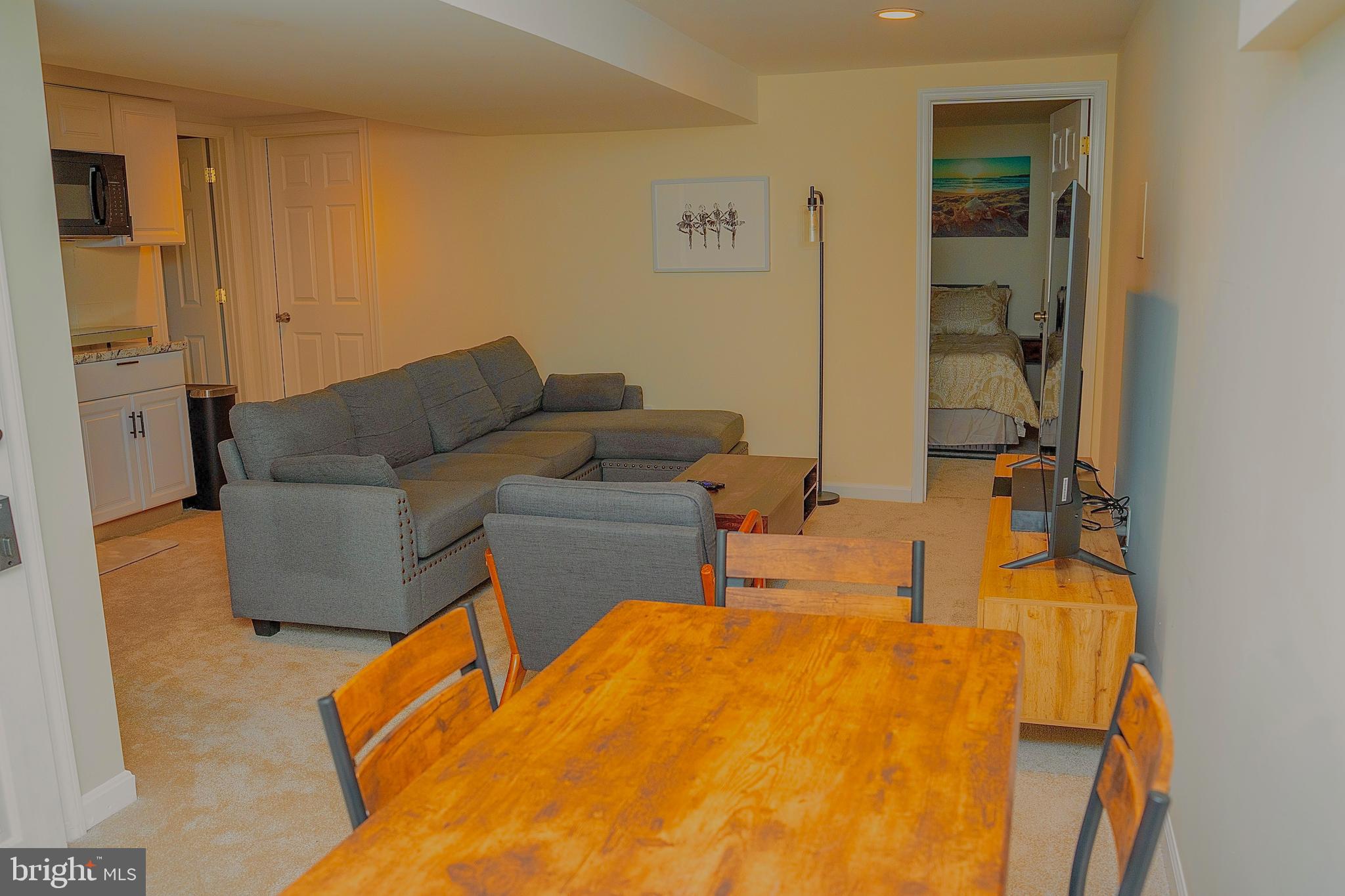 924 Veirs Mill Road Rockville, MD 20851 - Photo 5 of 12 a living room with furniture and a flat screen tv