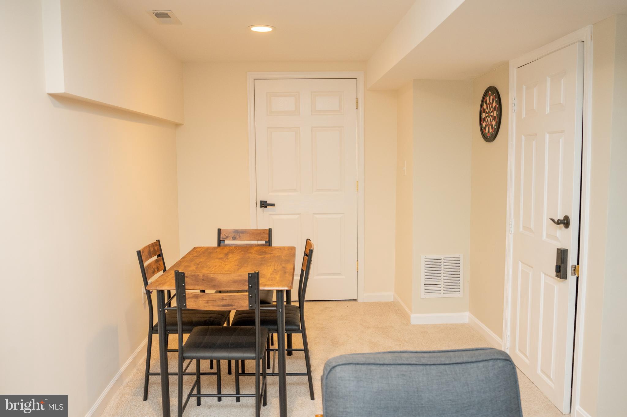 924 Veirs Mill Road Rockville, MD 20851 - Photo 7 of 12 a view of a dining room with furniture and a window