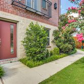 a view of a house with potted plants
