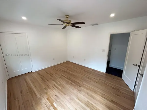 a view of a livingroom with an empty space and a window