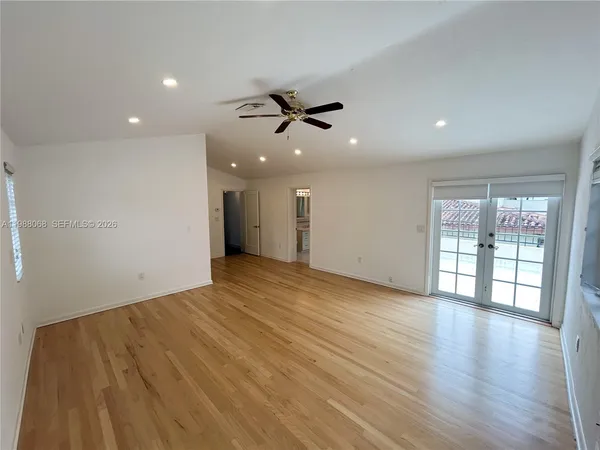 a view of a living room with a large window