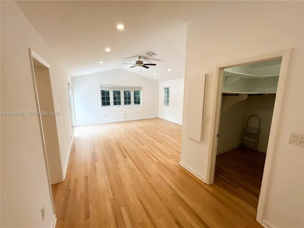 a view of an empty room with a window