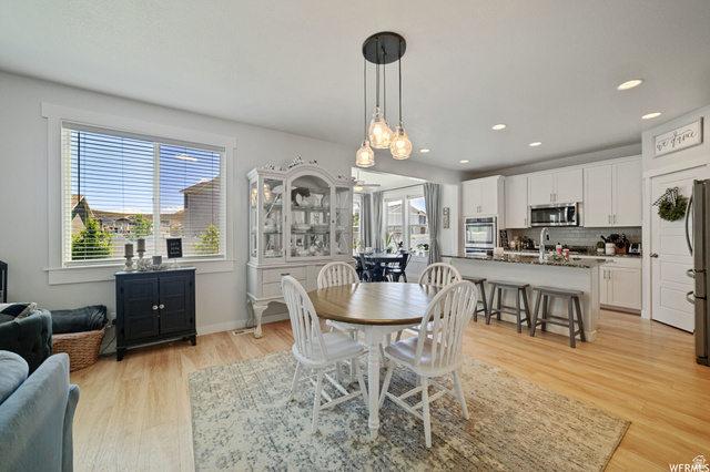 1836 Red Oak Road Eagle Mountain, UT 84005 - Photo 11 of 15 Dining space with light wood finished floors and recessed lighting