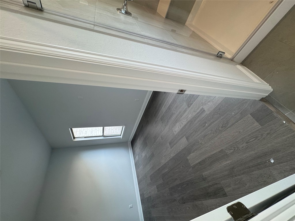 232 Camille Street Leander, TX 78641 - Photo 12 of 26 an empty room with wooden floor and windows