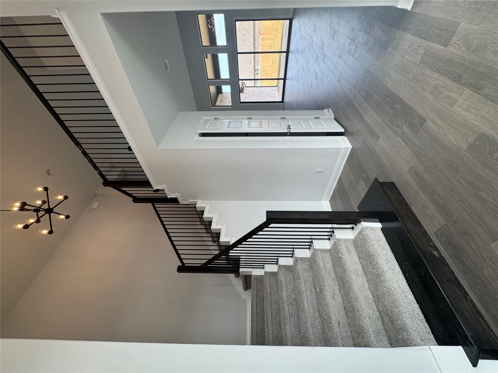 232 Camille Street Leander, TX 78641 - Photo 2 of 26 a view of staircase with wooden floor and fan
