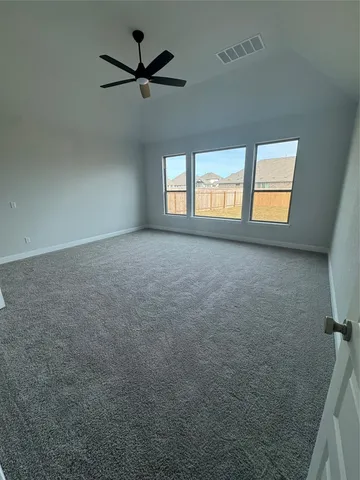 a spacious bathroom with a tub sink and mirror