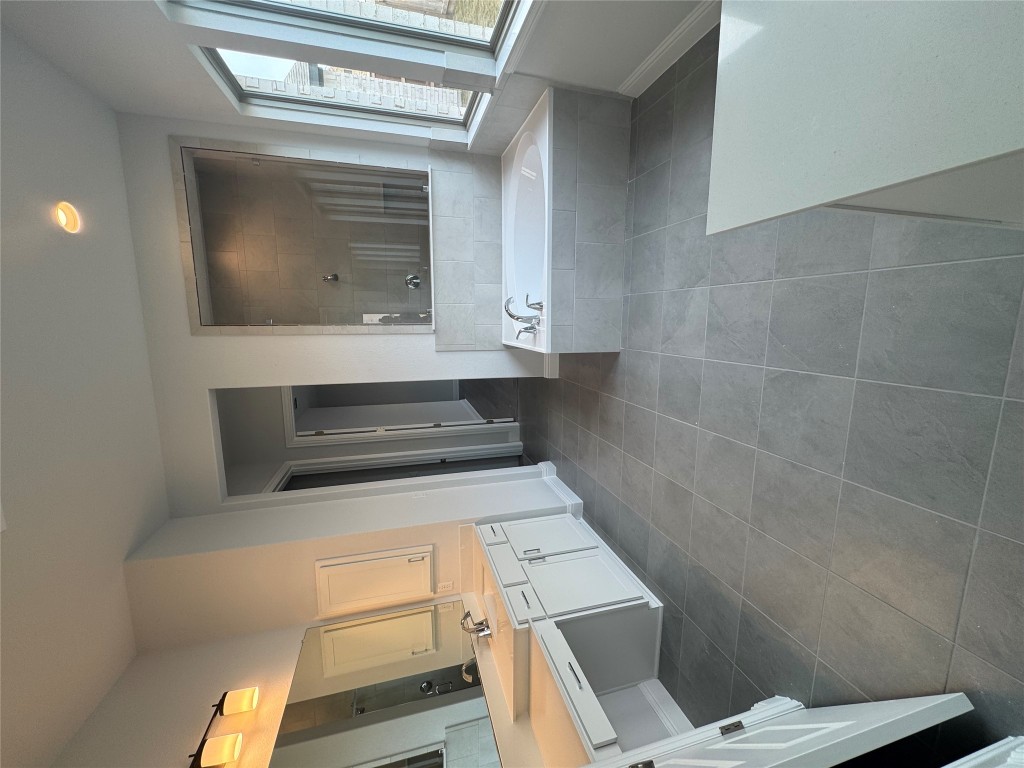 232 Camille Street Leander, TX 78641 - Photo 9 of 26 a spacious bathroom with a tub sink and mirror