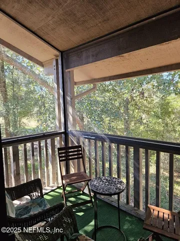 a view of a porch with furniture