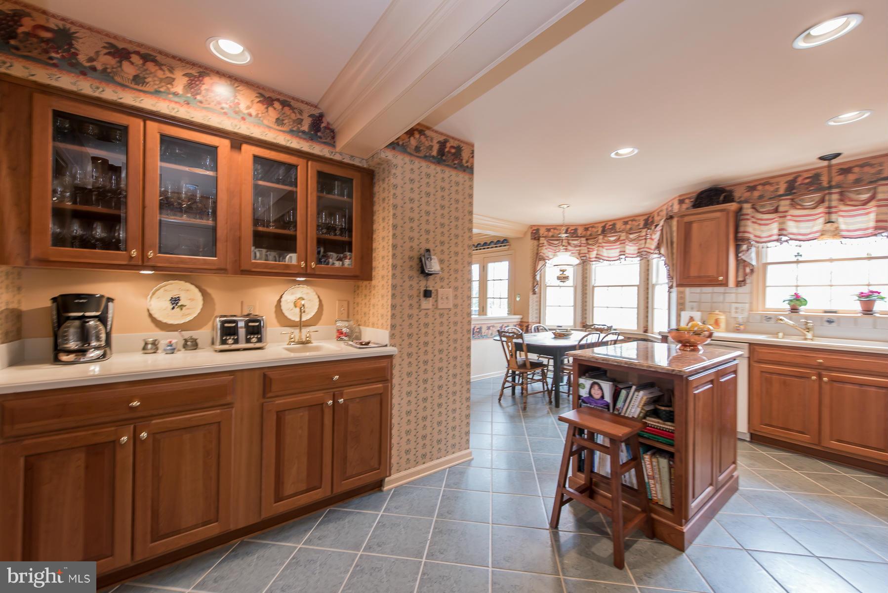 3677 Meadowvale Road Ellicott City, MD 21042 - Photo 15 of 30 a kitchen with a stove a sink and a refrigerator