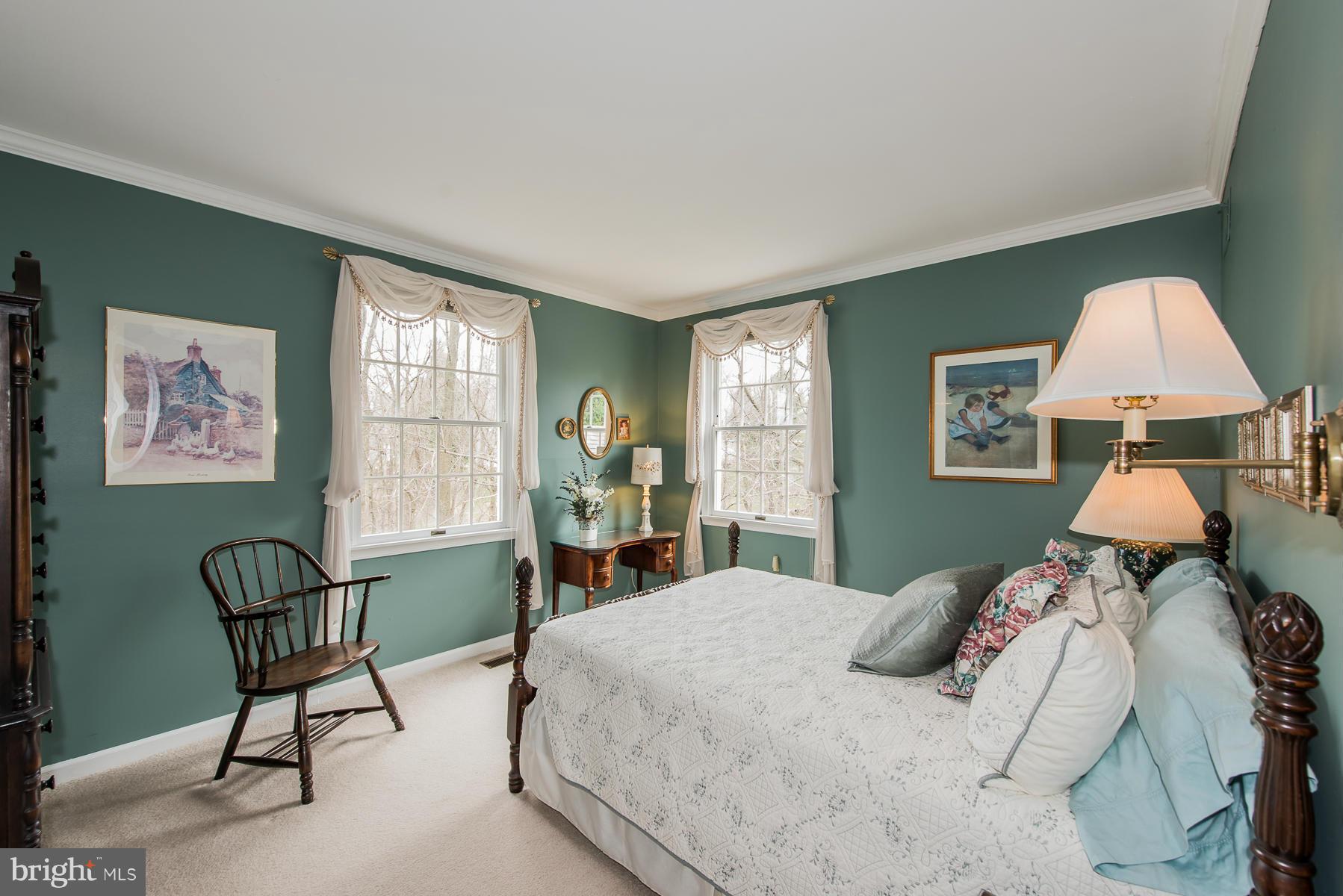 3677 Meadowvale Road Ellicott City, MD 21042 - Photo 18 of 30 a bedroom with a bed chair and a window