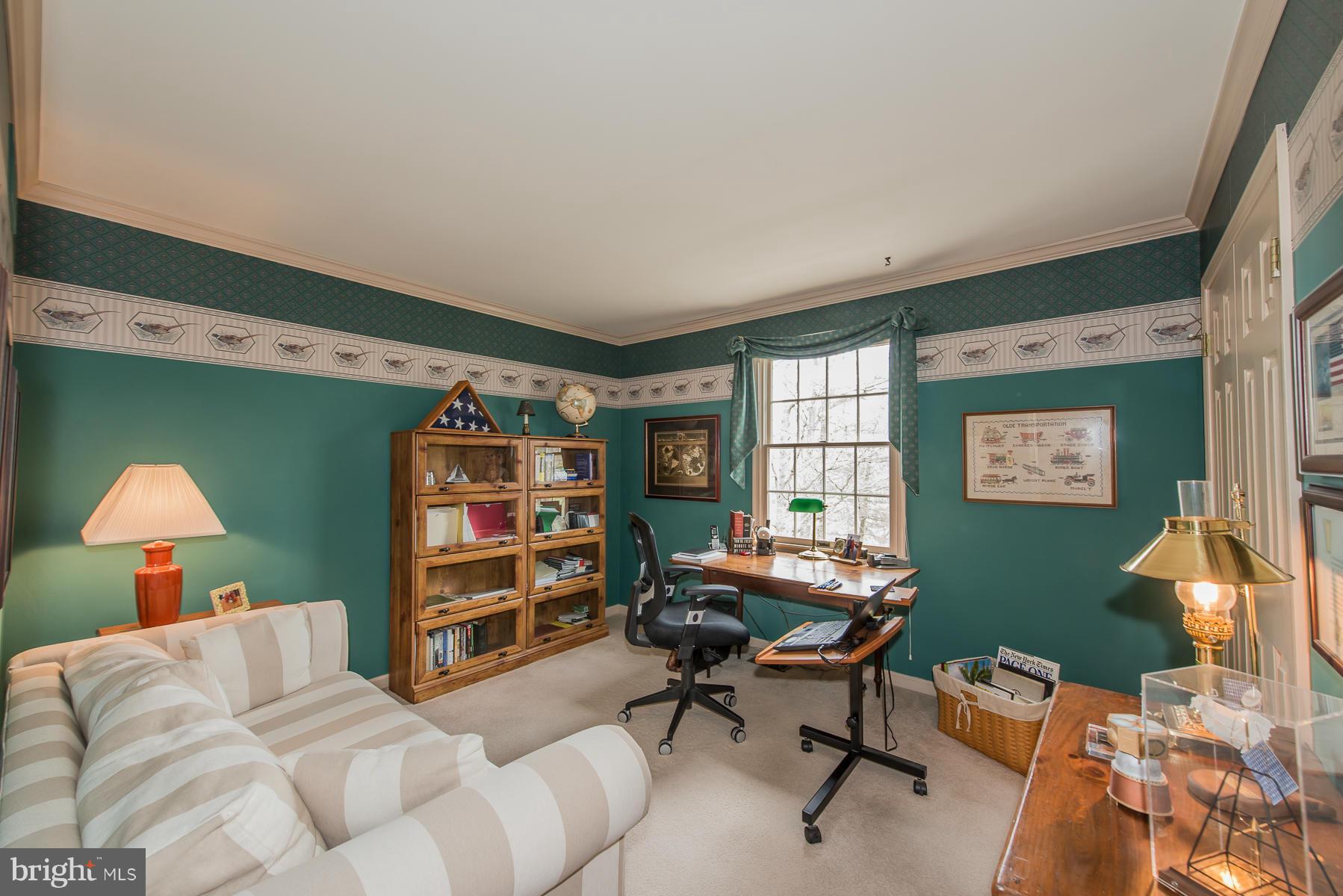 3677 Meadowvale Road Ellicott City, MD 21042 - Photo 20 of 30 a bedroom with a bed and a bookshelf