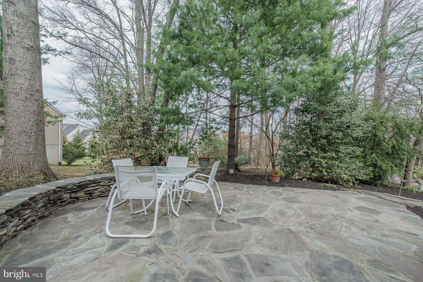 3677 Meadowvale Road Ellicott City, MD 21042 - Photo 27 of 30 a view of a chairs and table in the backyard