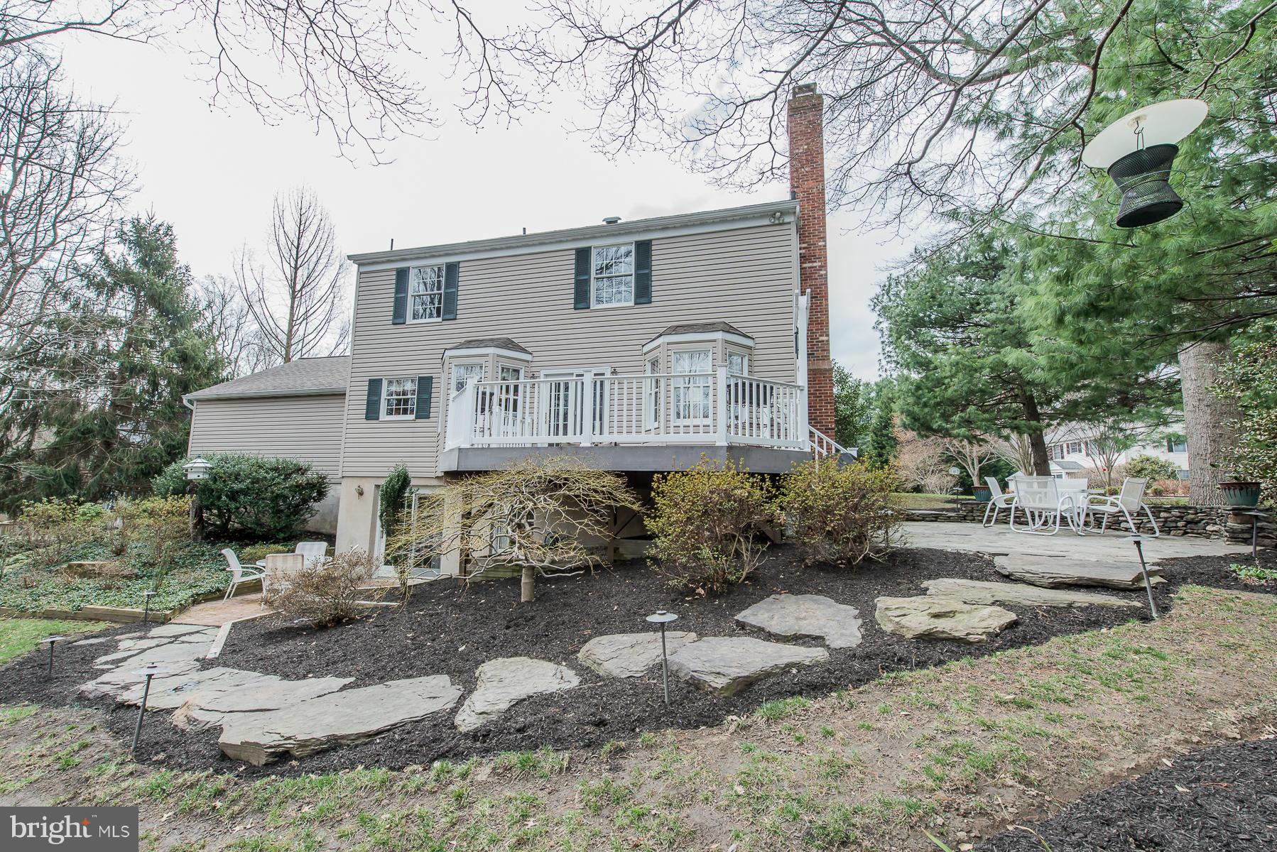 3677 Meadowvale Road Ellicott City, MD 21042 - Photo 30 of 30 a front view of a house with a yard covered with trees