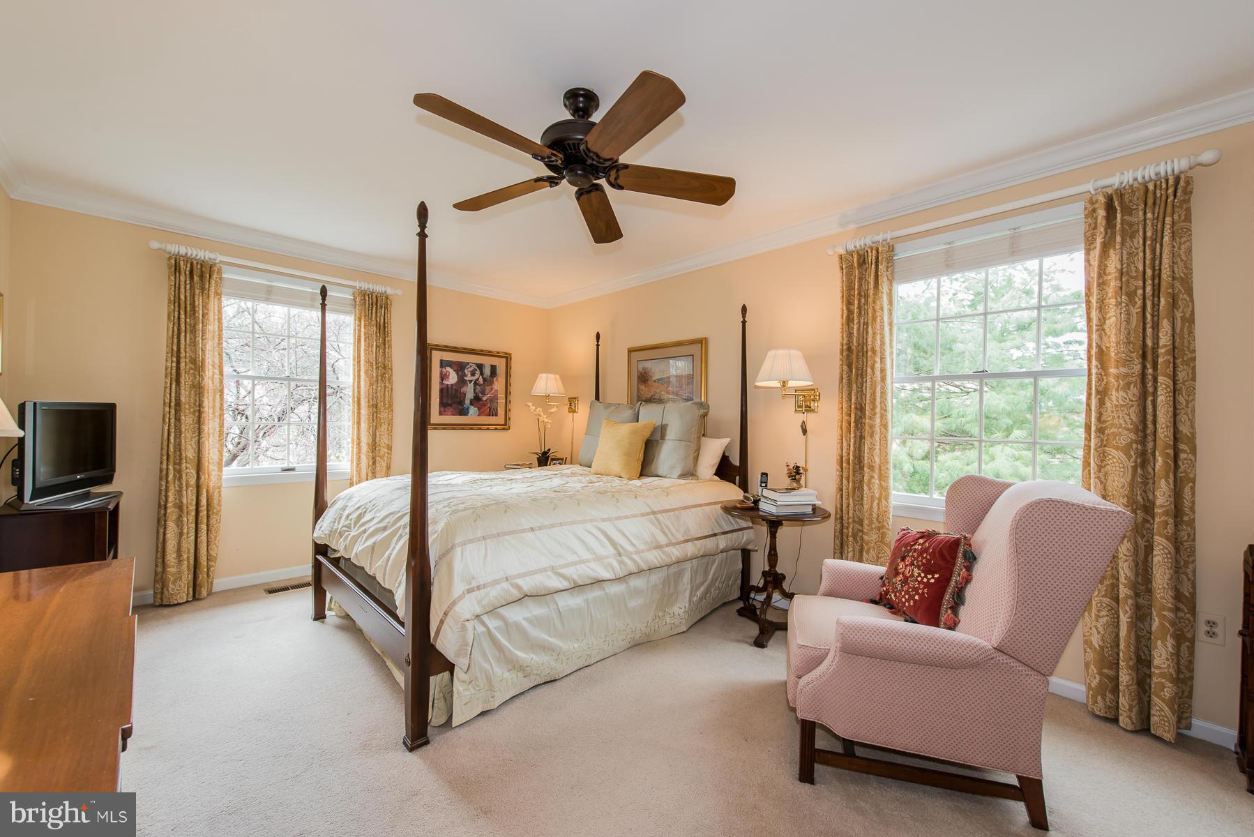 3677 Meadowvale Road Ellicott City, MD 21042 - Photo 4 of 30 a bed room with a bed and a chair
