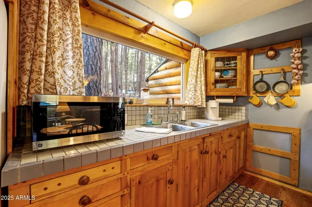 a kitchen with stainless steel appliances a stove and a sink